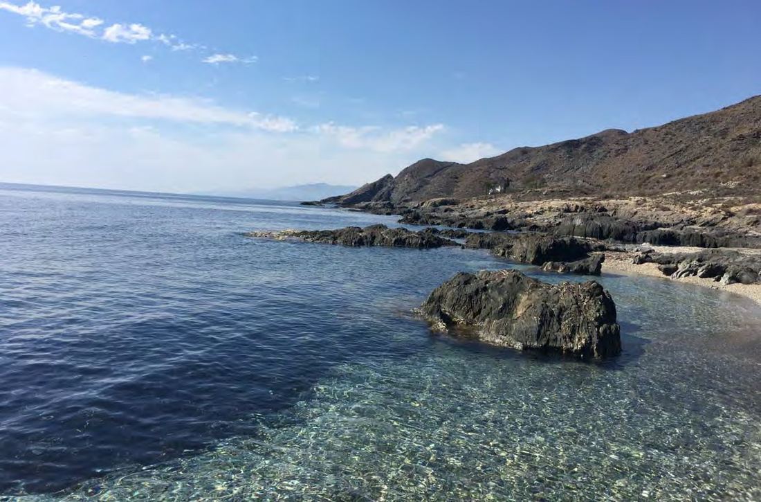Cala Cristal, a clear-water rocky cove near Molino de Guevara